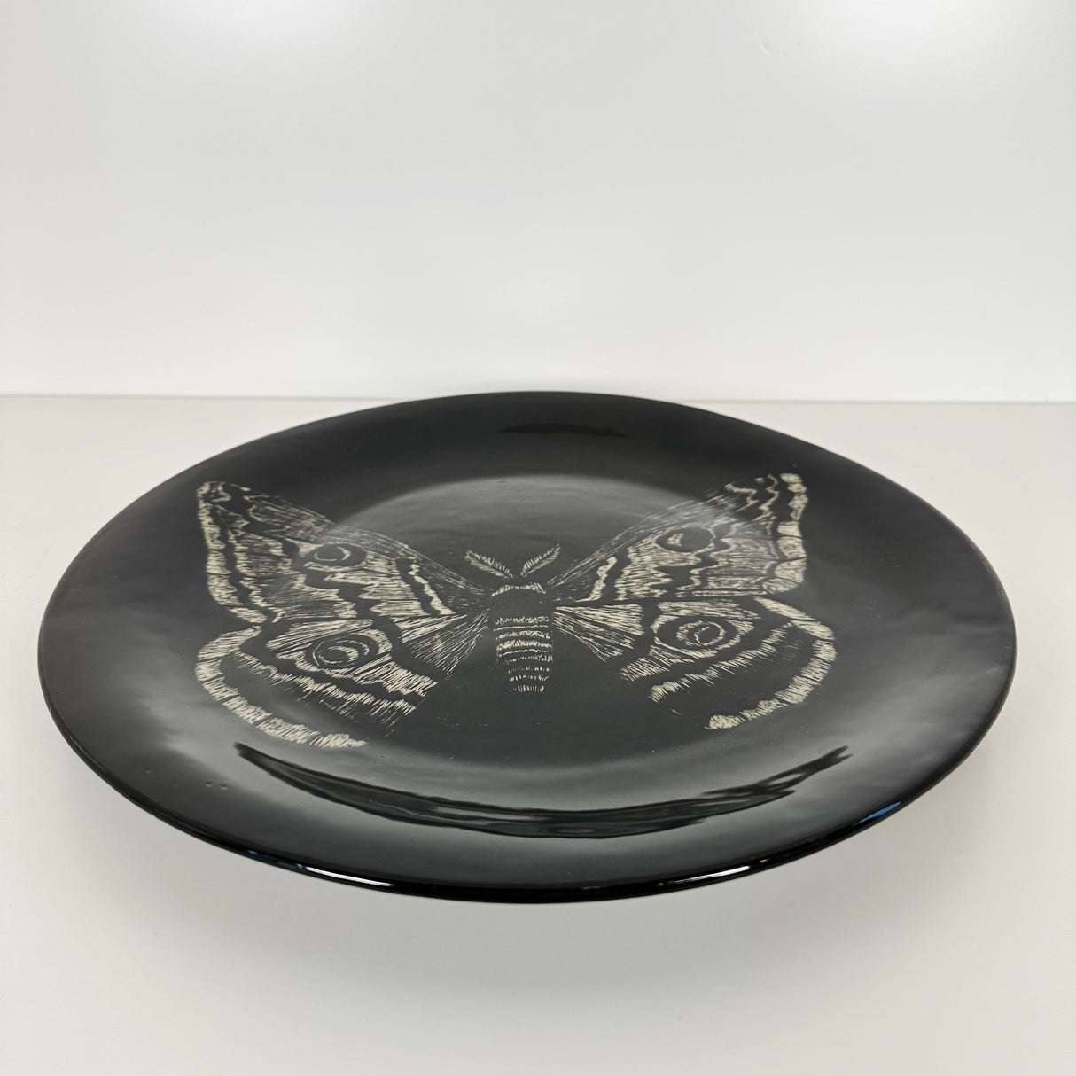 Large Inky Black Carved Moth Plate | Cindy Walker Davidson