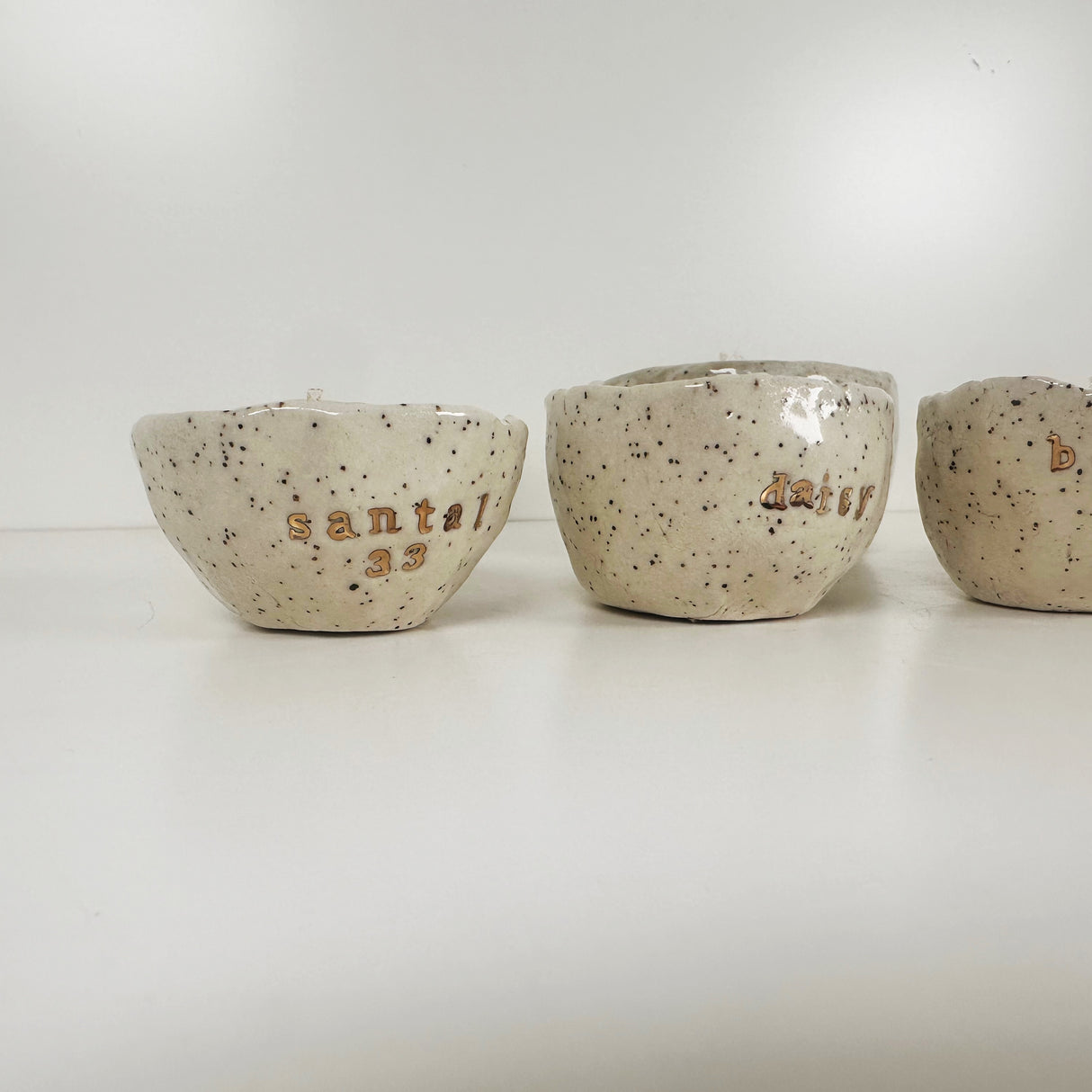 Speckled Stoneware Bowls Featuring 22k Gold and Designer Fragrances | Madeleine Schmidt