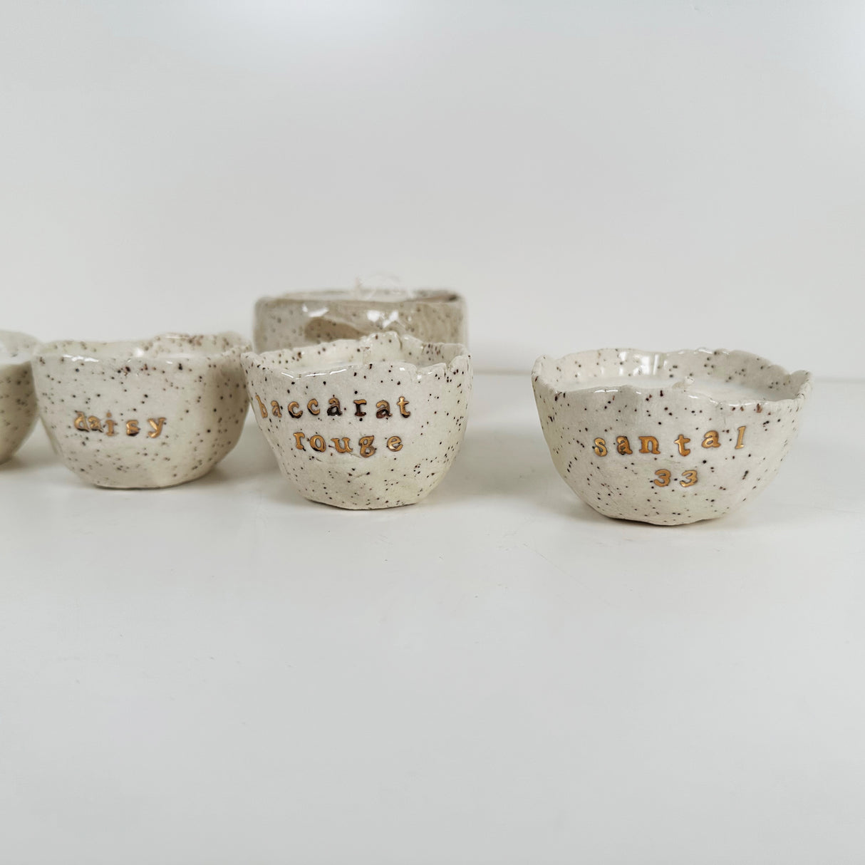 Speckled Stoneware Bowls Featuring 22k Gold and Designer Fragrances | Madeleine Schmidt