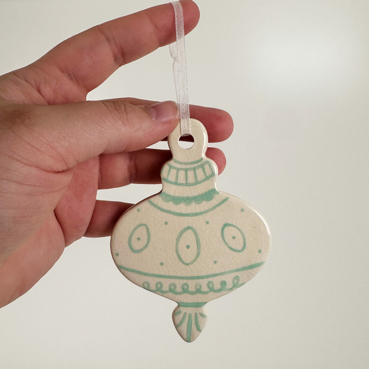 Hand Painted Flat Sea Foam Green Patterned Bauble Ceramic Ornament | Terra Clay