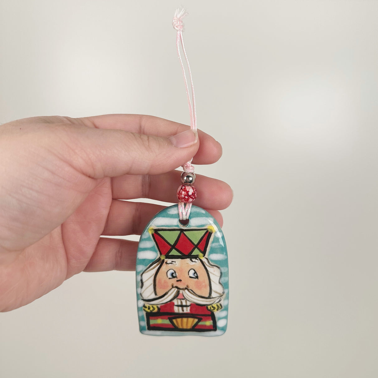 Handpainted Turquoise, Green, & Red Nutcracker Ornament | Poppy Chick Studio