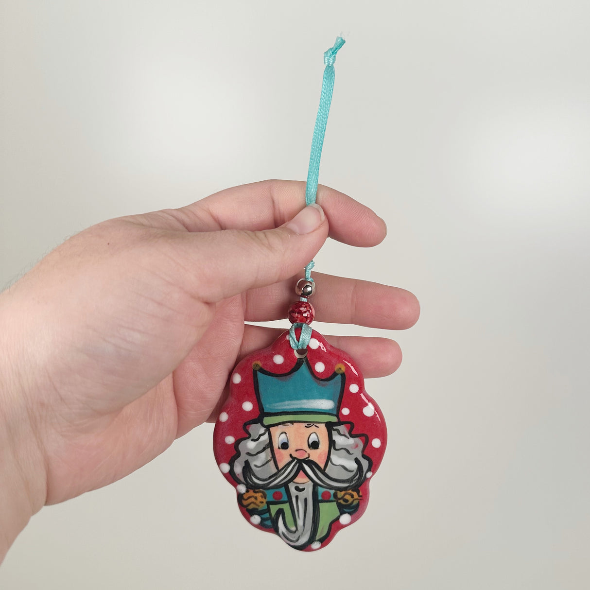 Handpainted Red Scalloped Oval Nutcracker Ornament | Poppy Chick Studio