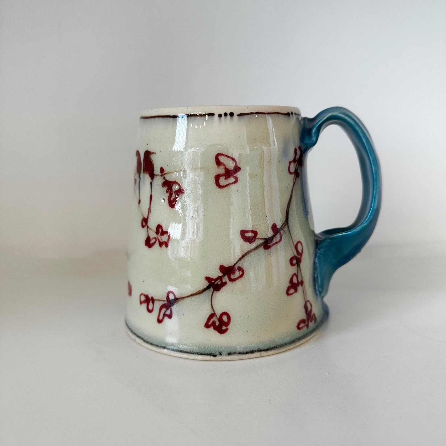 Cherry Mug with Turquoise Handle | Muddy Paws Pottery