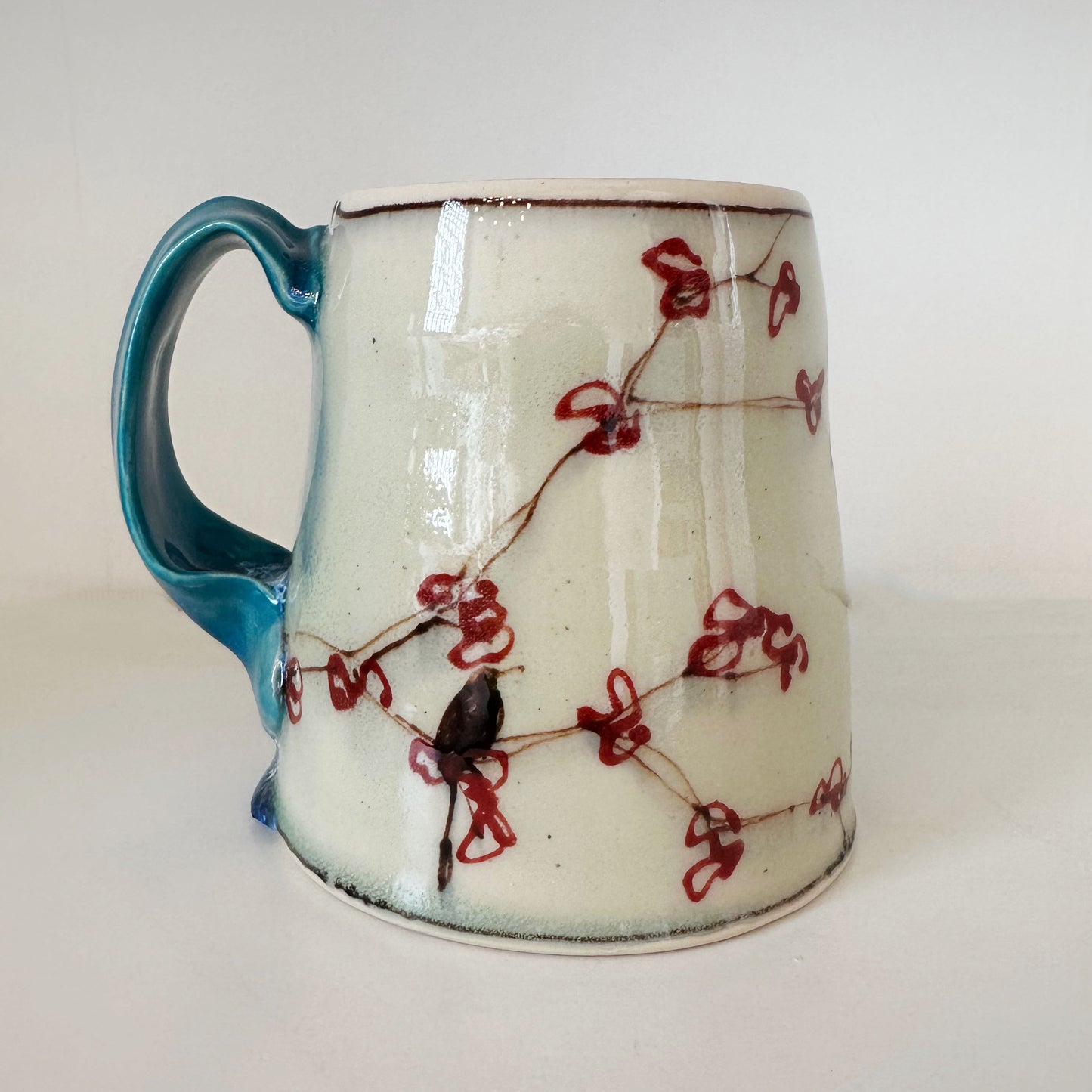 Cherry Mug with Turquoise Handle | Muddy Paws Pottery