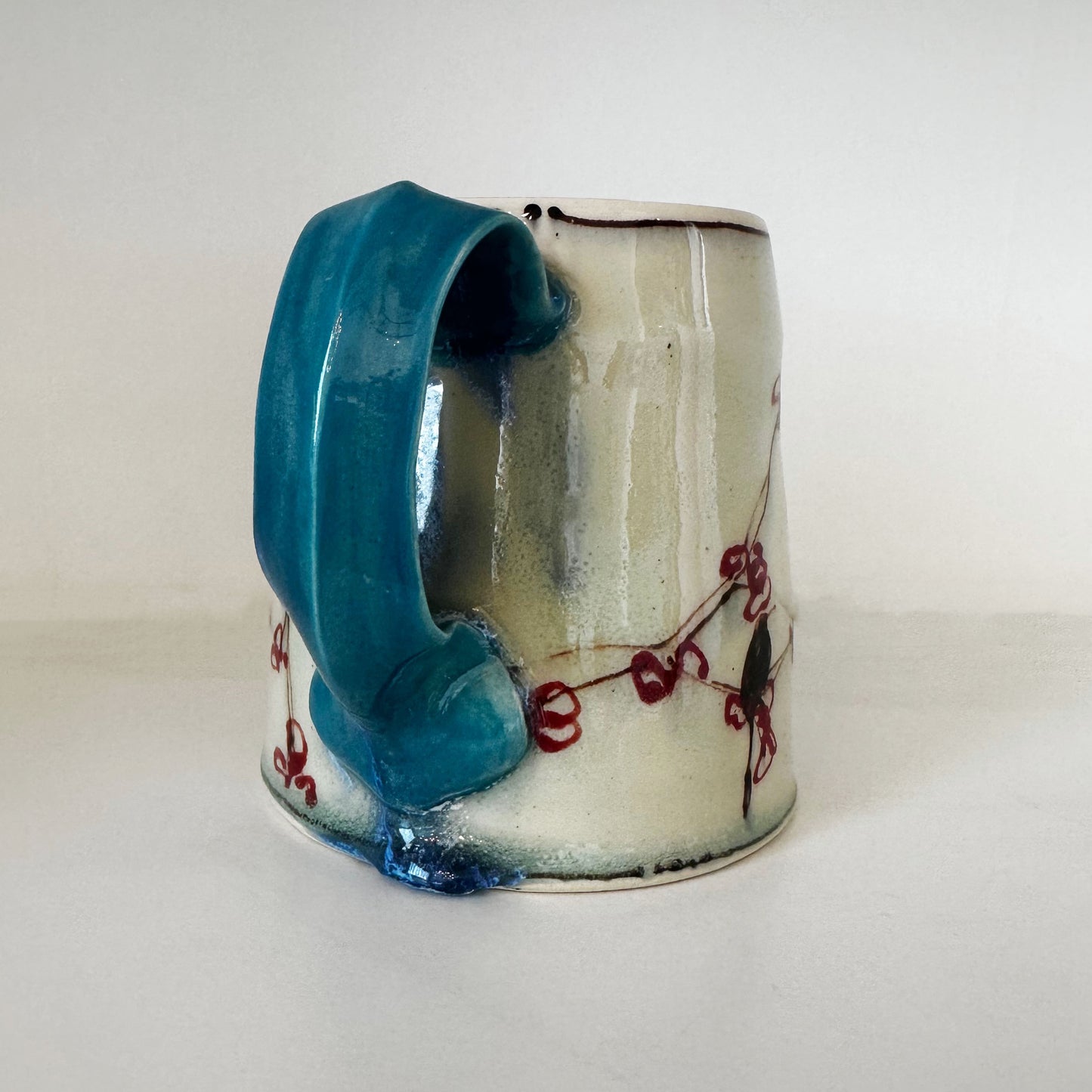 Cherry Mug with Turquoise Handle | Muddy Paws Pottery