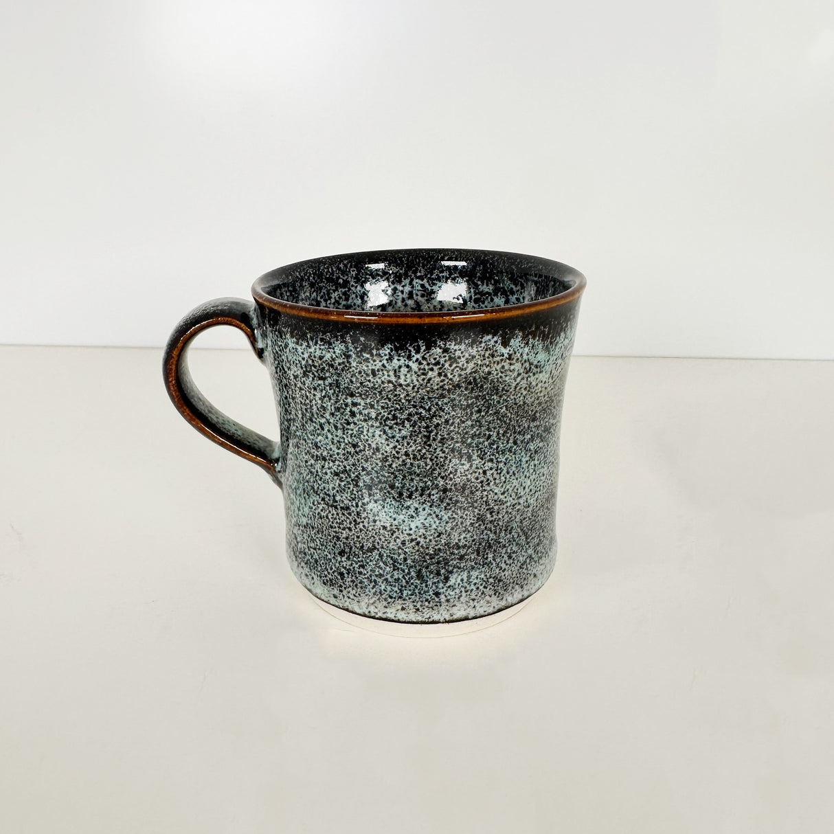 Speckled Light Blue and Navy Mug with Brown Rim | Pottery by Mike