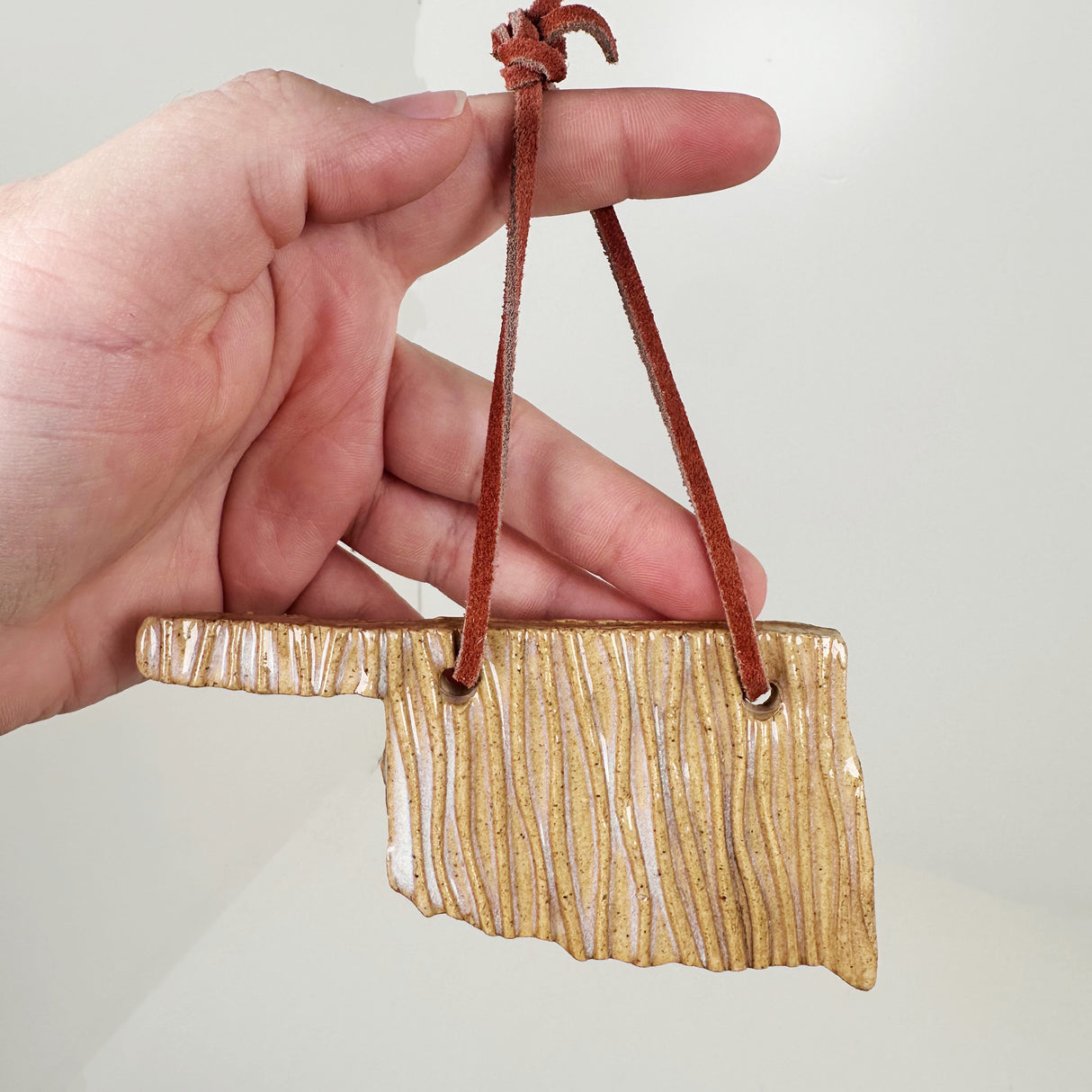 Tan Wood Texture Oklahoma Shaped Ornament | Triska Pottery