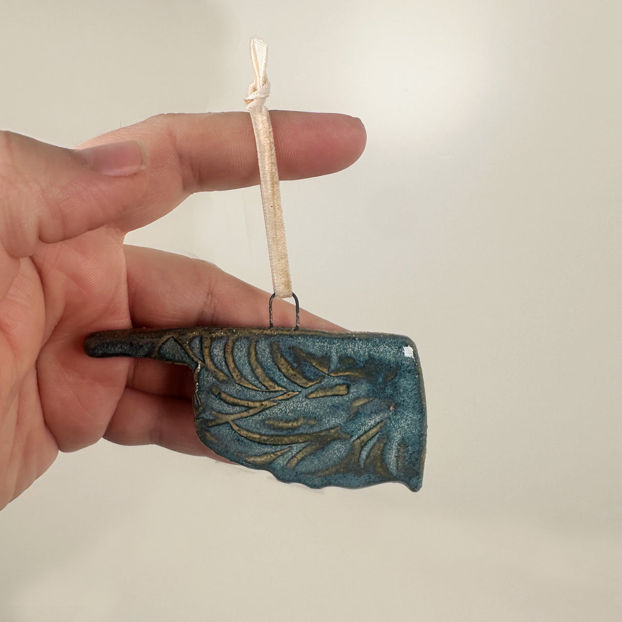 Blue Oklahoma Shaped Ornament with Swirl Imprint- A | Lazy Clay Lady