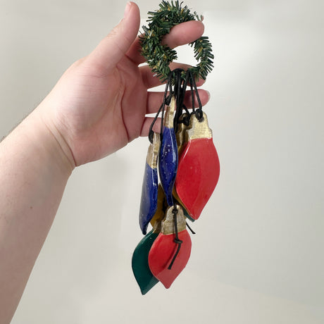 String of Colorful Ceramic Christmas Light Bulb Ornaments | Lisa Goldfarb