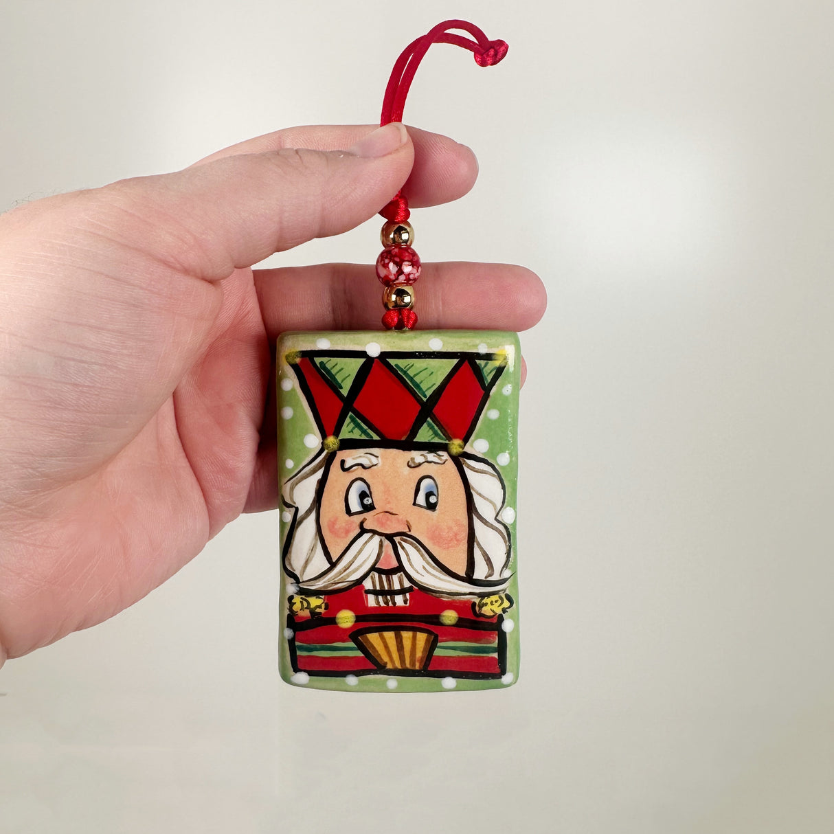 Handpainted Green Rectangle Nutcracker Ceramic Ornament | Poppy Chick Studio